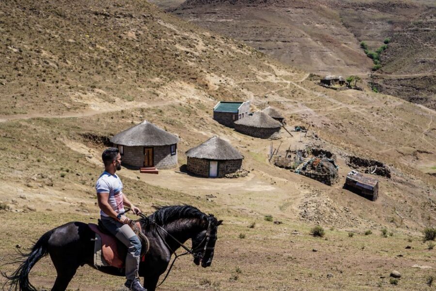4x4 into Lesotho From Underberg - Horse Ride / Village Life - Basotho village visit and bread tasting: more than a quick photo stop
