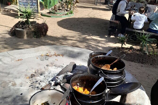Bicycle or Tuk Tuk Soweto Guided Experience - Lunch at Boma & Outdoor Restaurant: potjie, pap, braai