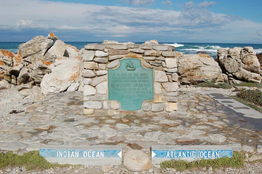 Cape Agulhas, Hermanus whales & Wine Tasting Day Trip - Standing where the Atlantic meets the Indian at Cape Agulhas