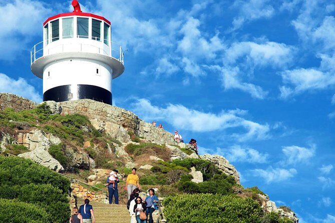 Cape Point Explore with Boulder's Penguins Small Group Day Tour - Cape of Good Hope lighthouse walk: the ocean drama at Africa’s southwestern tip