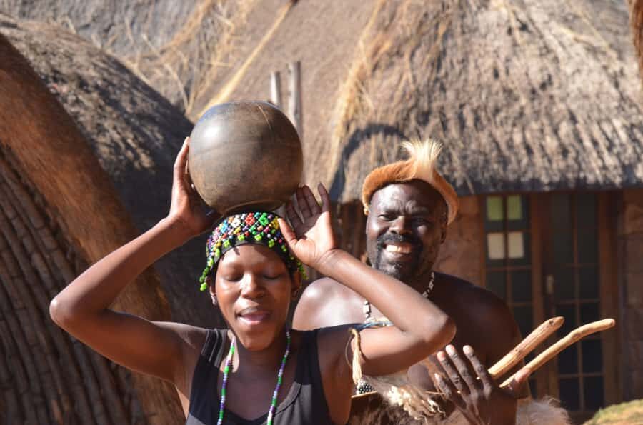 Durban: Phezulu Cultural Village & Reptile Park Tour - Entering Phezulu Cultural Village: huts, rituals, and the Zulu dance show