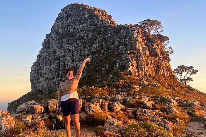 Guided Sunset/Sunrise Hike on Lions Head,Cape Town (Hotel Pickup) - Sunrise on Lion’s Head: golden light over Helderberg and Table Mountain