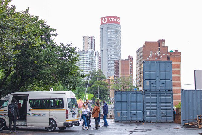 Johannesburg's Migration History with a local lunch - Hillbrow streets: vendors, calm pockets, and two iconic towers nearby