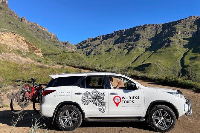 Sani Pass 4X4 Day Tour and Lesotho Village Visit - Lesotho summit stops: passport stamping and curio time